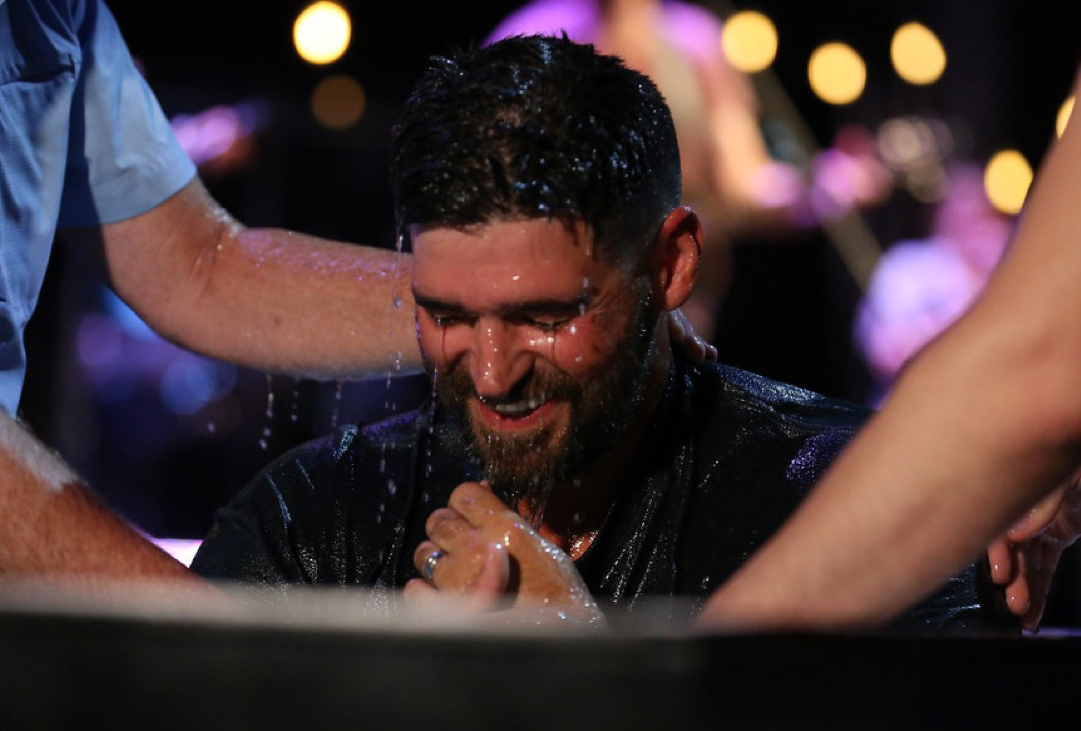 Jason Berry being baptized